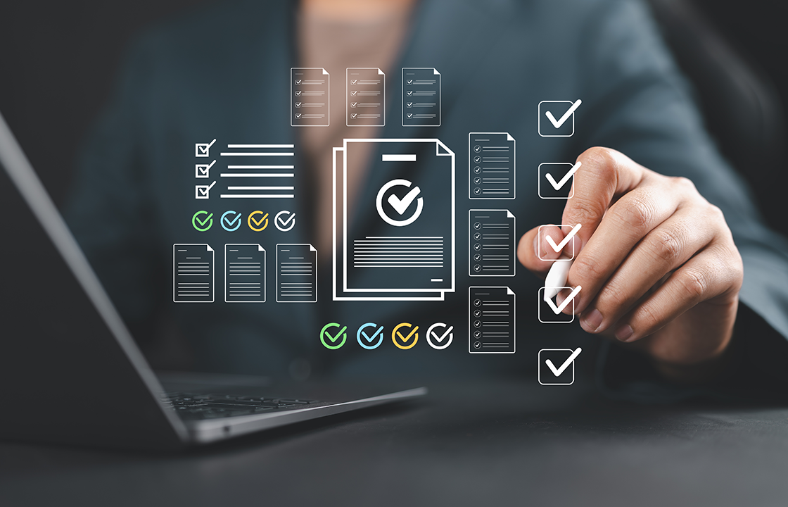 document icons hovering over a laptop